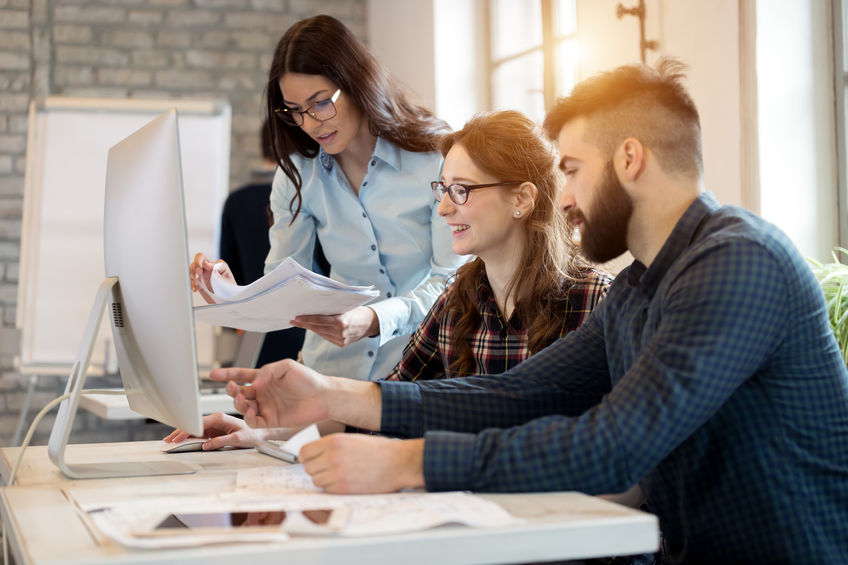 Young architects working on project in office