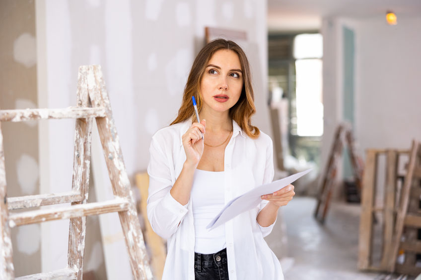 Woman construction manager checking project documentation